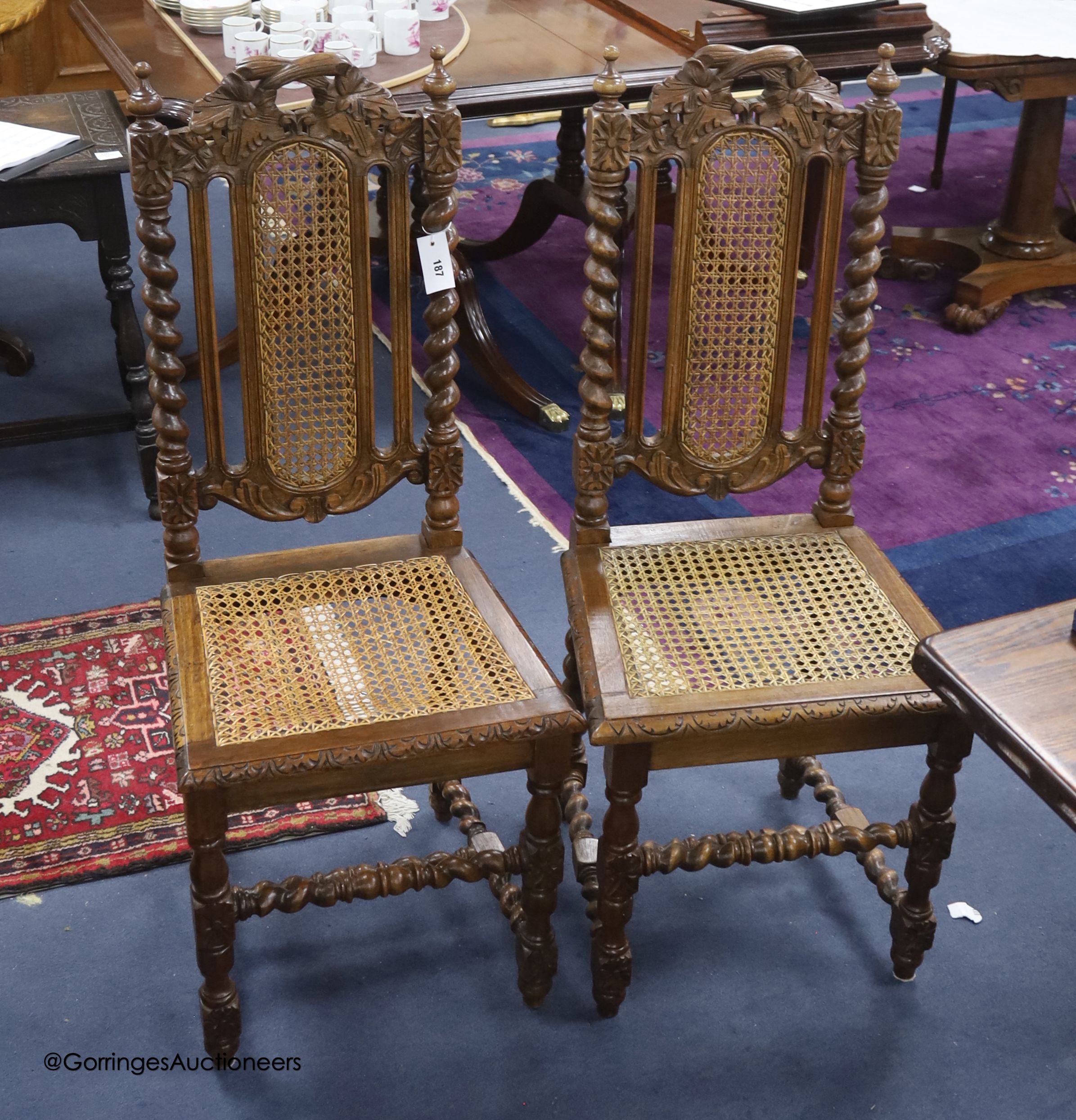 A set of twelve late Victorian caned oak dining chairs